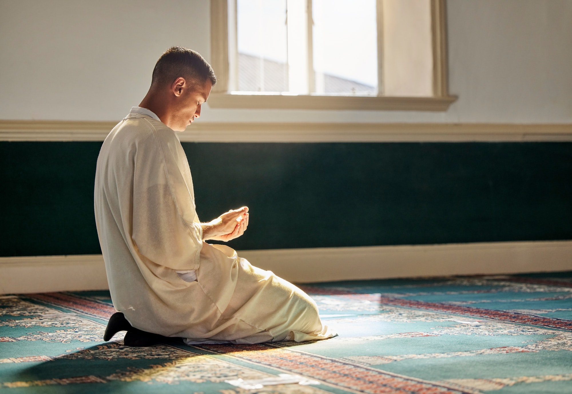 mosque-worship-and-muslim-man-in-prayer-on-his-knees-for-gratitude-support-or-ramadan-for-spiritu.jpg